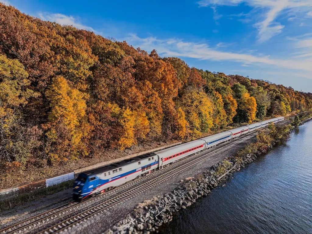 Amtrak train traveling through scenic American landscape