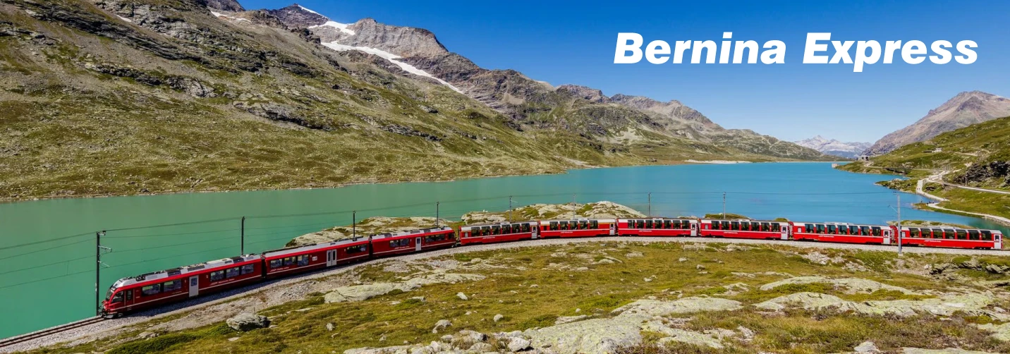 Bernina Express crossing a curved viaduct above a turquoise Alpine lake in Switzerland