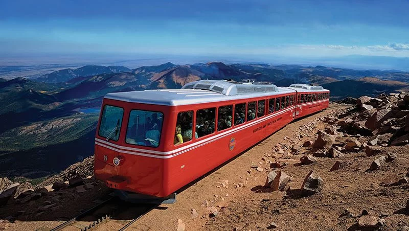 Amtrak California Zephyr train winding through Colorado Rocky Mountains