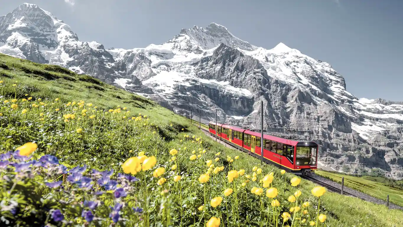 Jungfrau Railway with Swiss Alps mountain peaks in the background